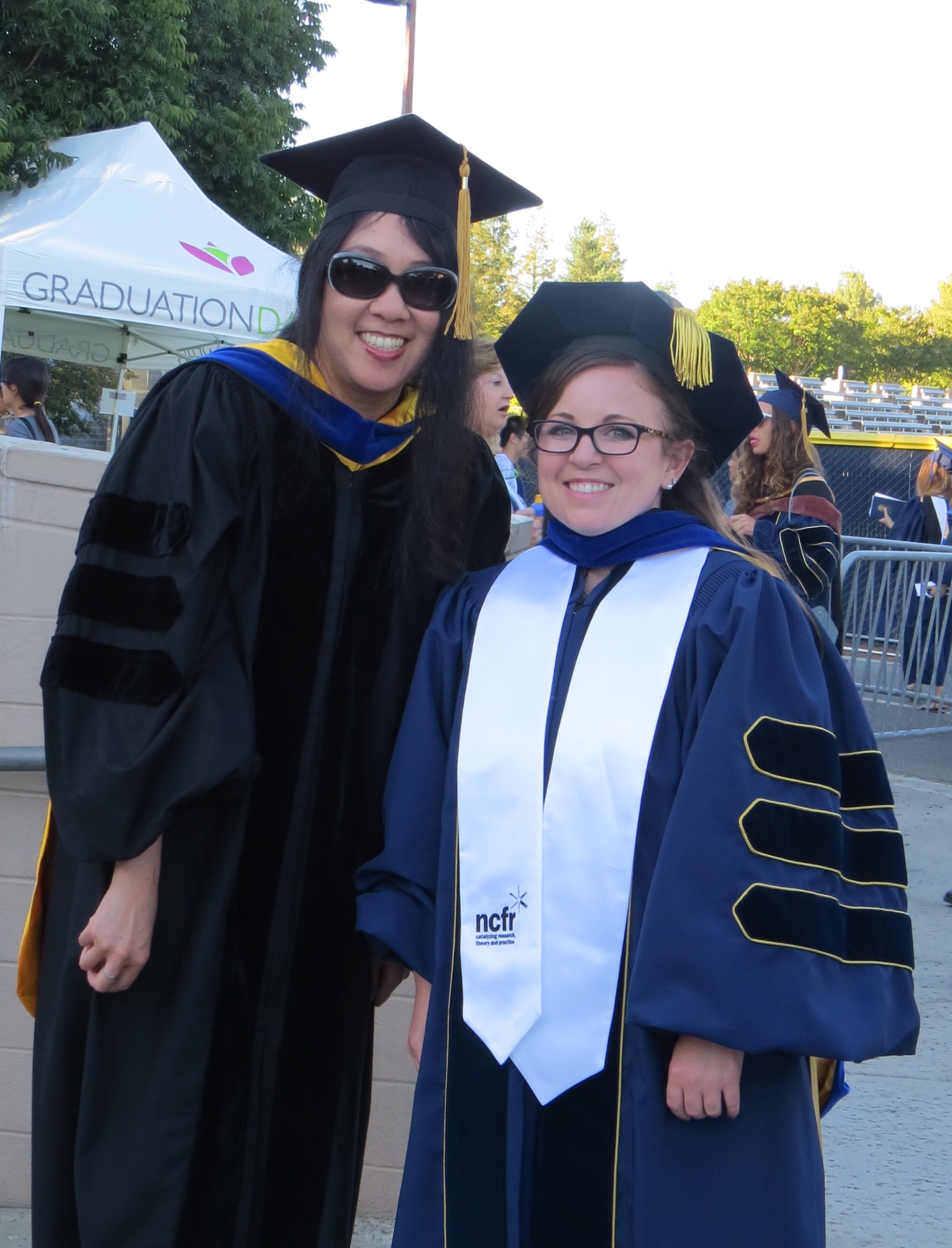 Carolyn with Dr. Adrienne Nishina at her PhD graduation ceremony.